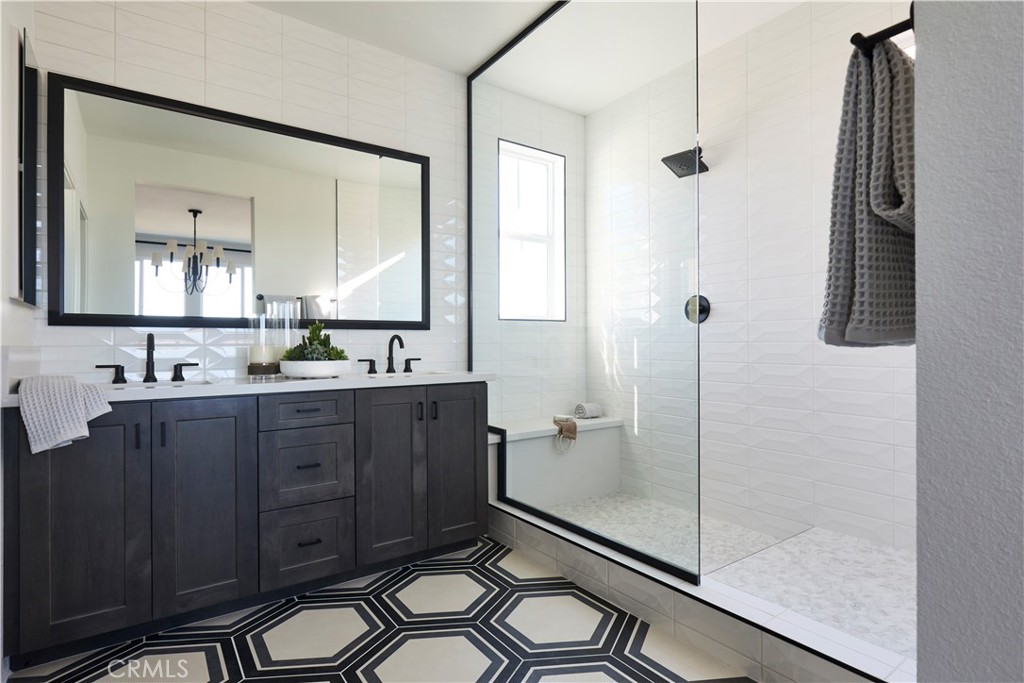11531 Jack Street Beaumont, CA 92223 - Photo 9 of 16 a bathroom with a double vanity sink toilet mirror and window
