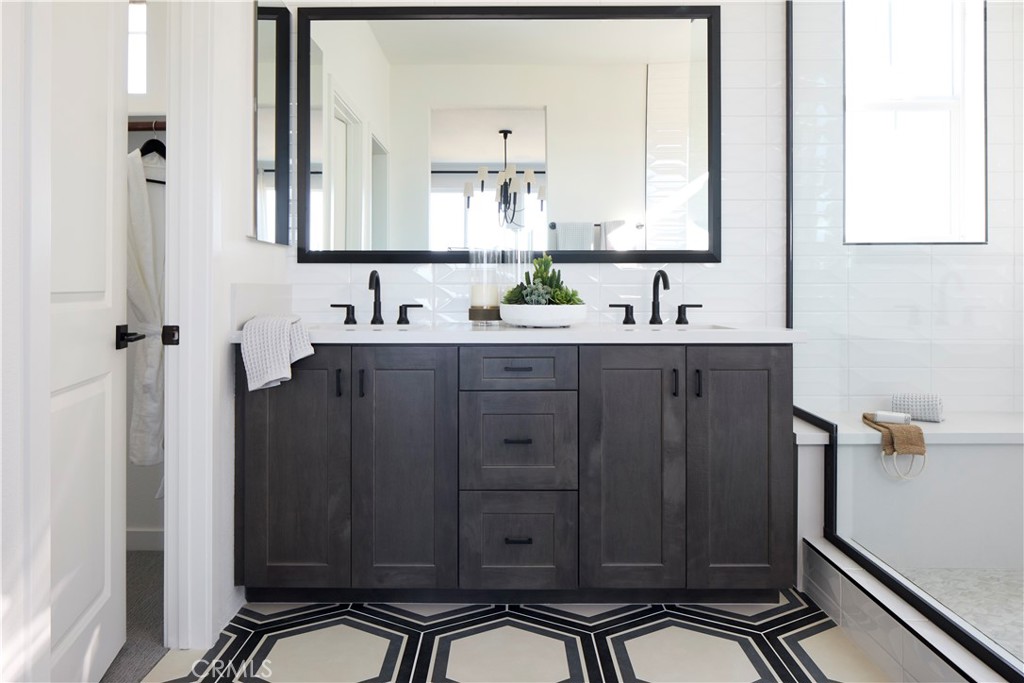11531 Jack Street Beaumont, CA 92223 - Photo 10 of 16 a bathroom with a sink a mirror and a shower