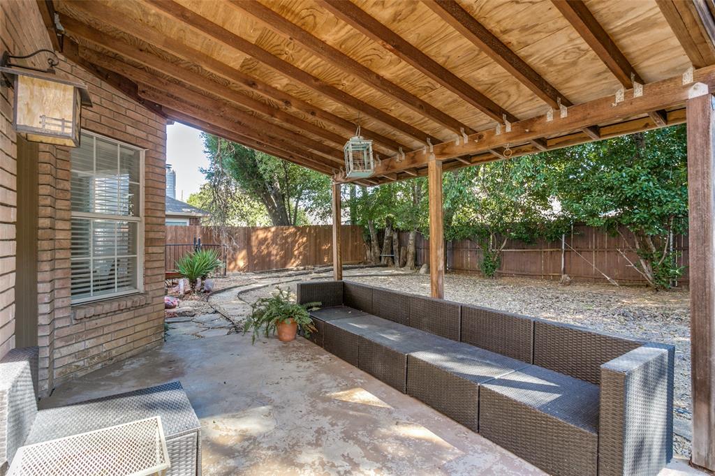2133 Rim Rock Drive Keller, TX 76248 - Photo 31 of 37 Fenced backyard with a patio and an outdoor hangout area