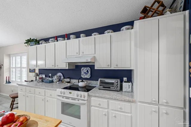 a room with furniture and a view of bedroom
