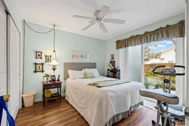 a bed room with a bed and a chandelier