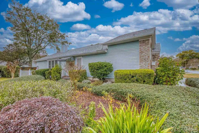 a view of a house with a garden