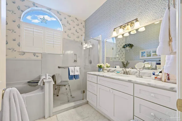 a white bath tub sitting next to a white toilet