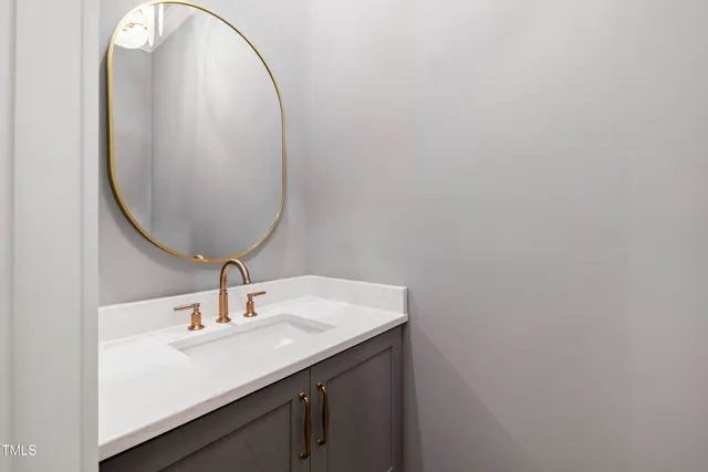 a kitchen with appliances a table chairs sink and cabinets