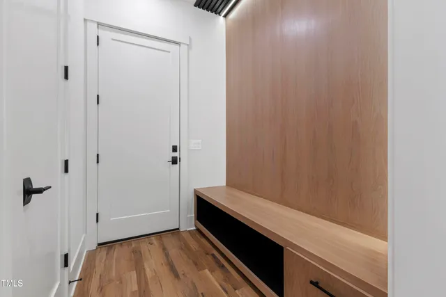 a kitchen with stainless steel appliances a stove a sink a counter space and cabinets