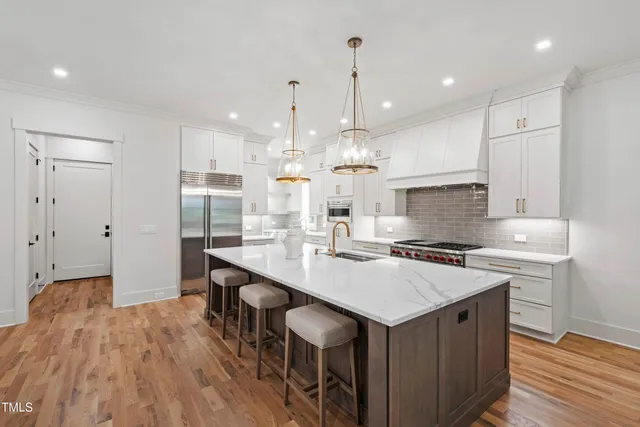 a stove top oven sitting inside of a kitchen