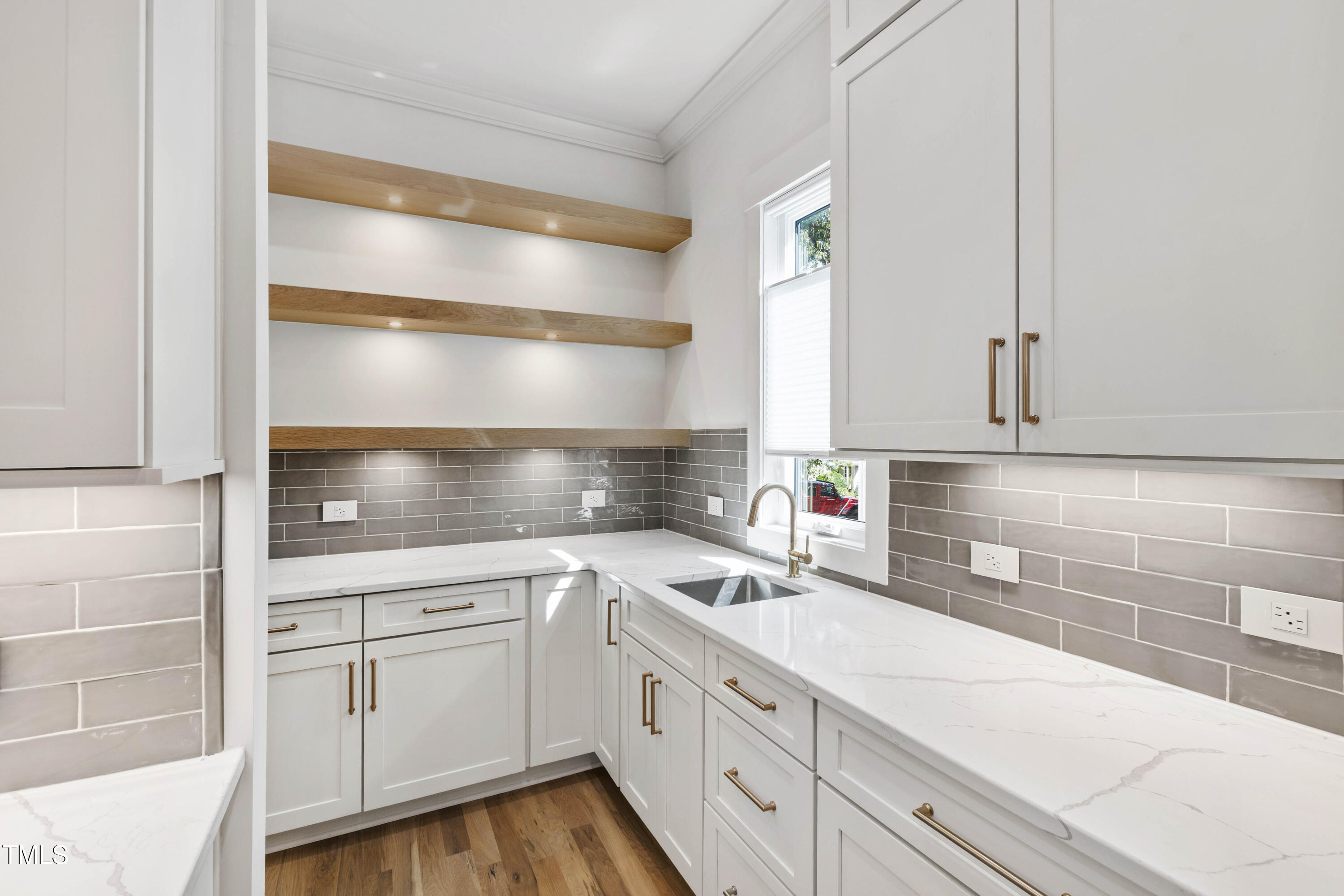 202 Georgetown Road Raleigh, NC 27608 - Photo 23 of 64 a kitchen with a sink and cabinets