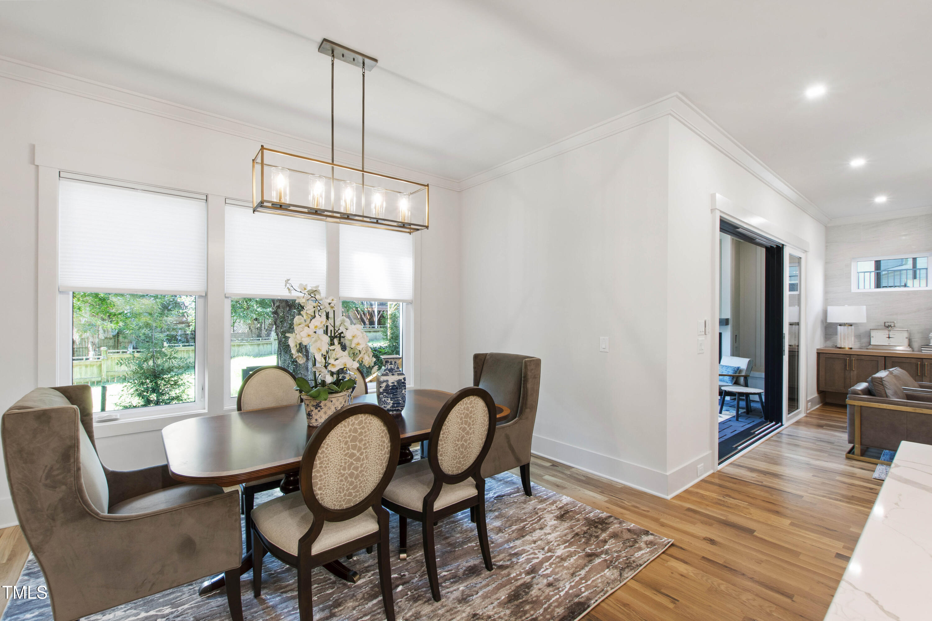 202 Georgetown Road Raleigh, NC 27608 - Photo 26 of 64 a view of a dining room with furniture window and wooden floor