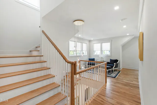 an empty room with a window and a ceiling fan
