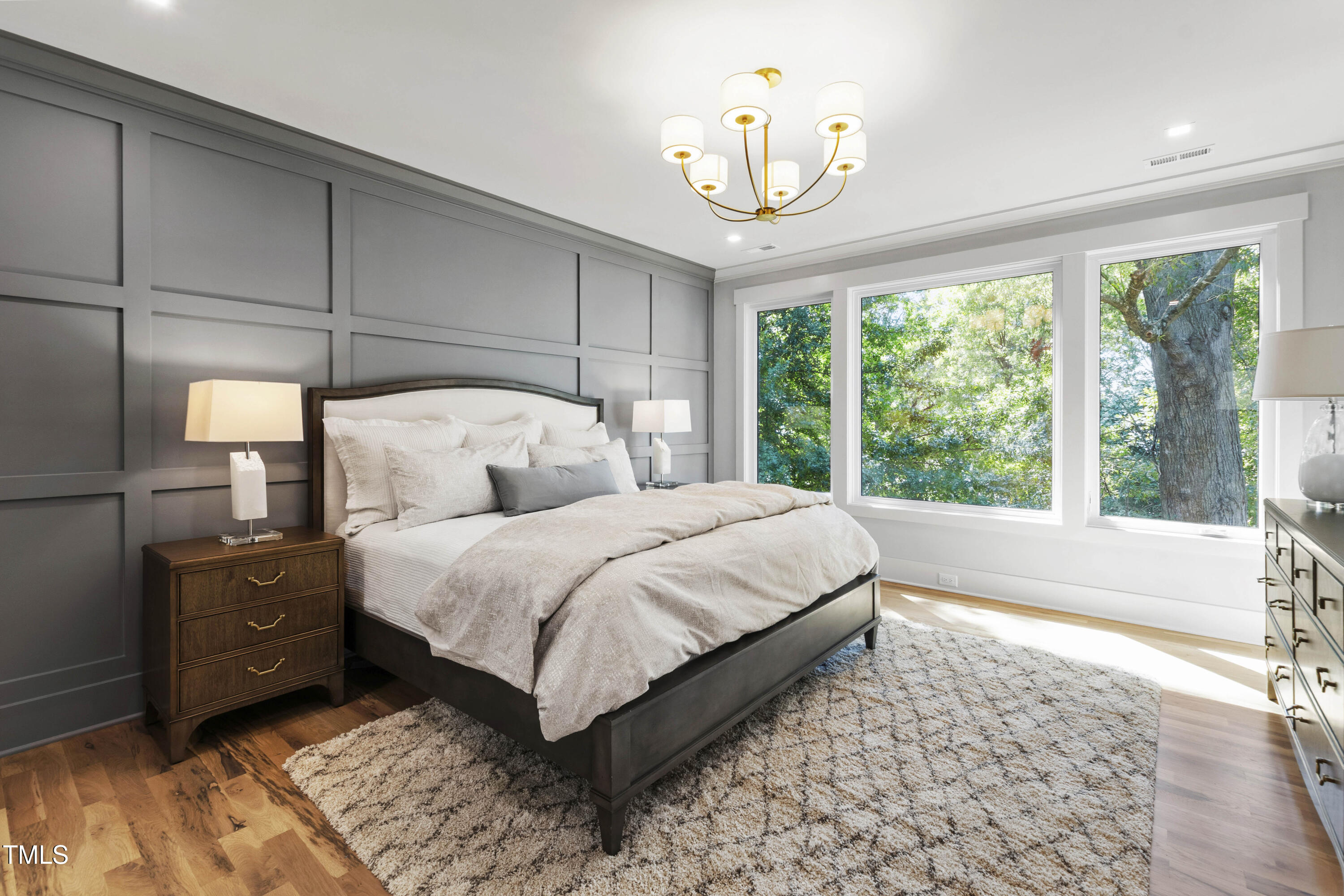 202 Georgetown Road Raleigh, NC 27608 - Photo 35 of 64 a bedroom with a bed lamp and a large window