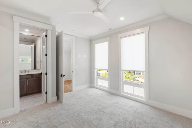 an empty room with a empty space and windows