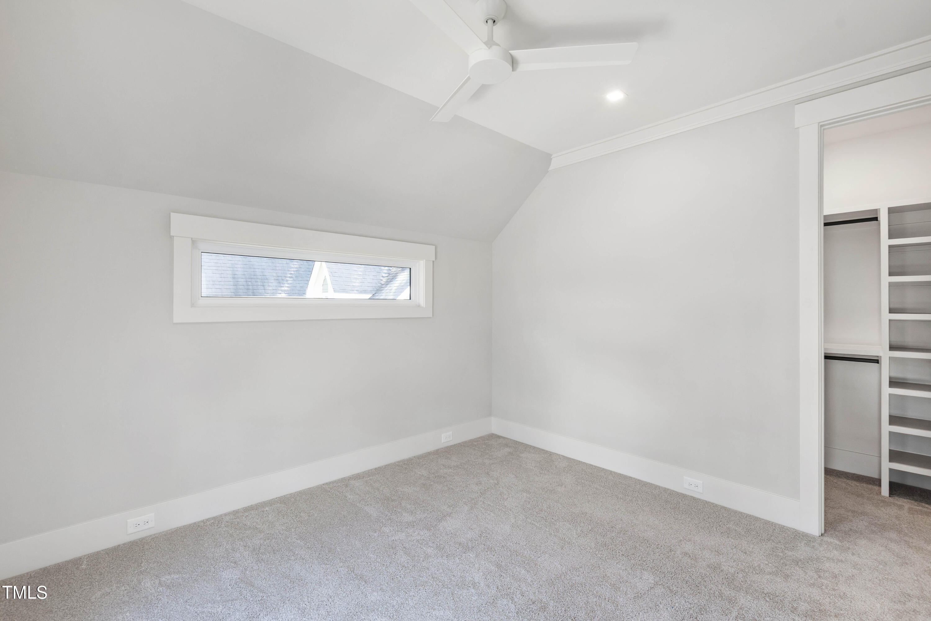 202 Georgetown Road Raleigh, NC 27608 - Photo 42 of 64 an empty room with a window and a ceiling fan