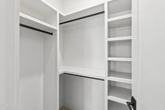 a room with a sink cabinets and utility