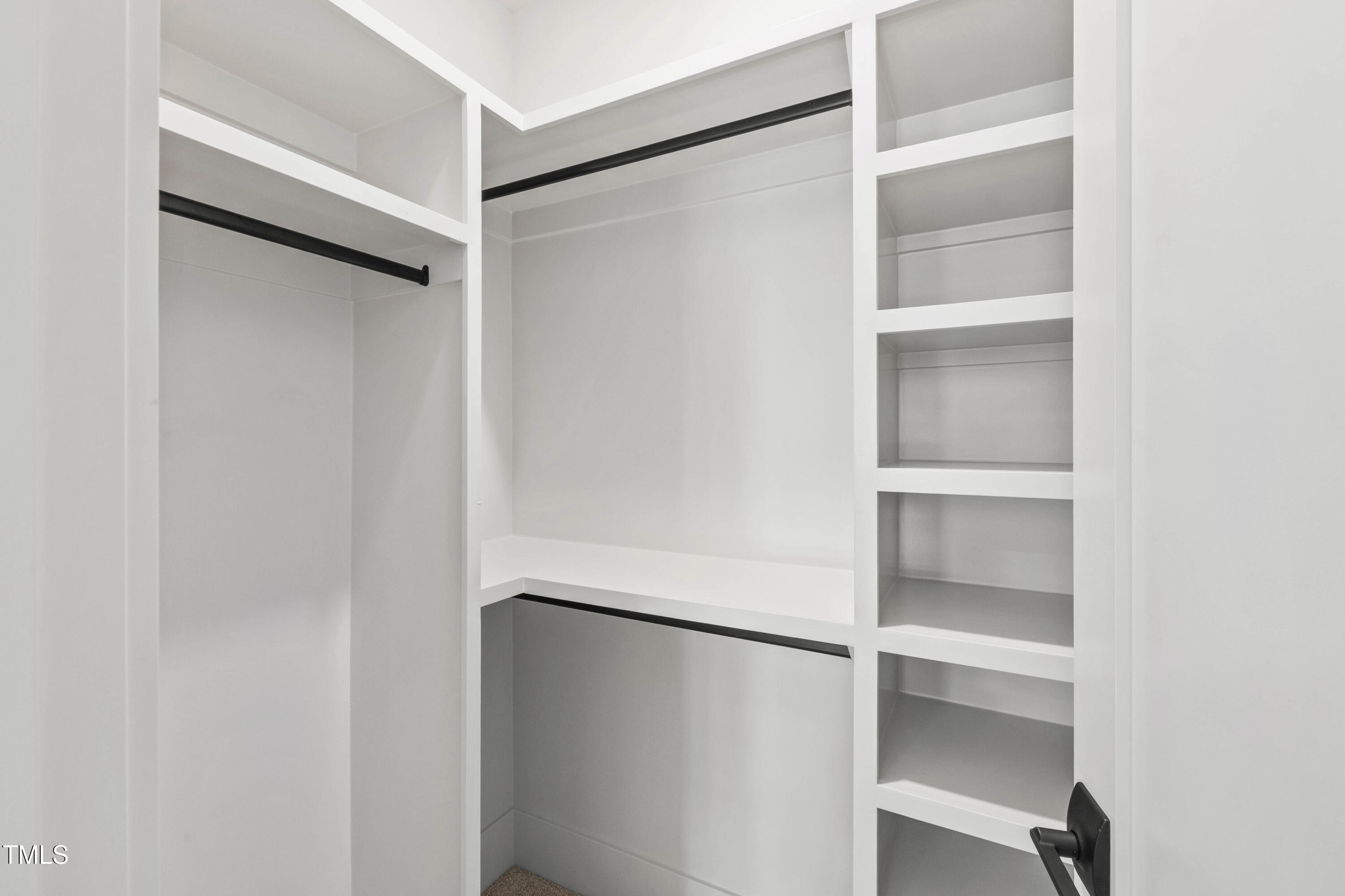 202 Georgetown Road Raleigh, NC 27608 - Photo 43 of 64 a view of an empty walk in closet