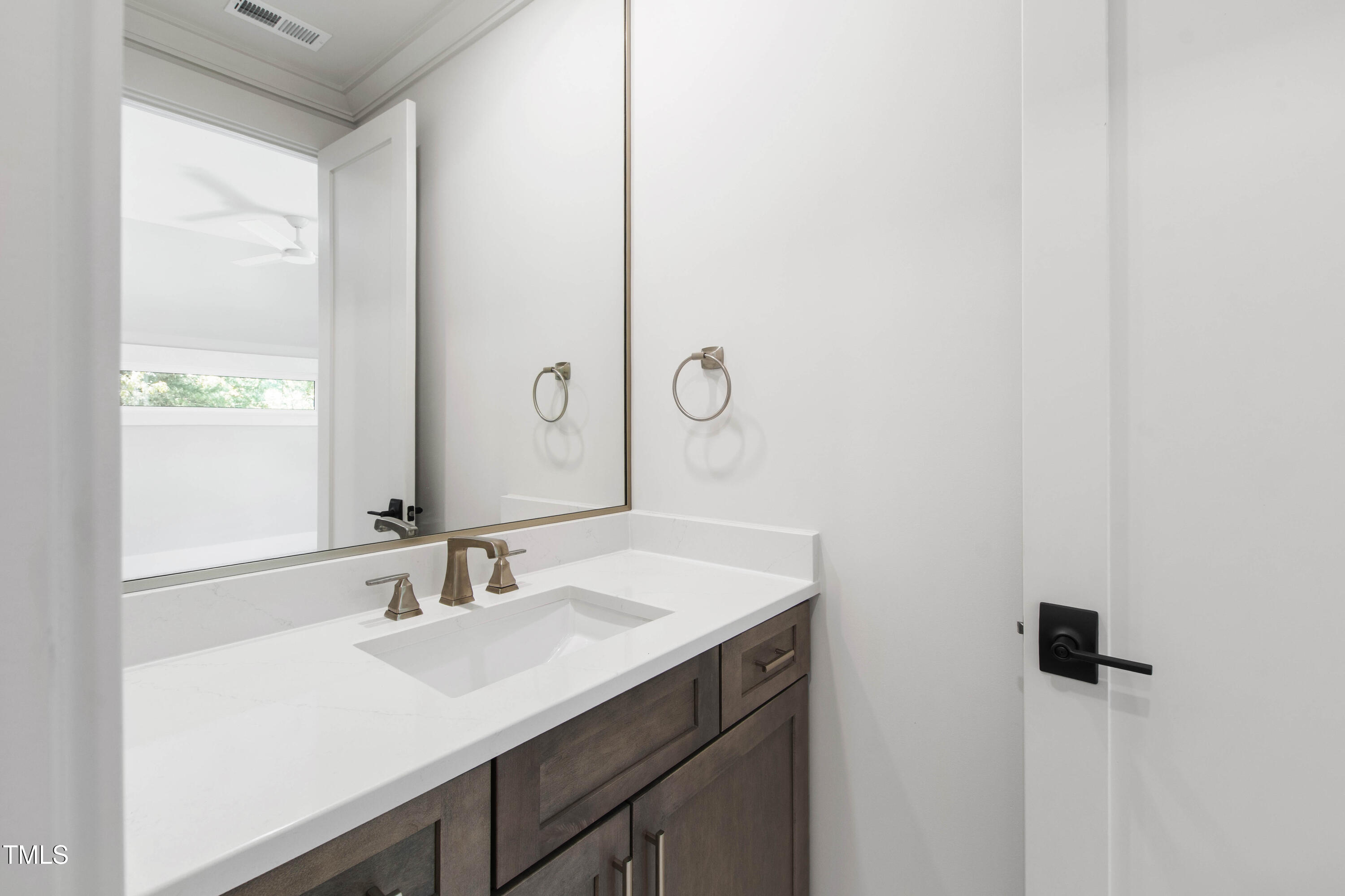 202 Georgetown Road Raleigh, NC 27608 - Photo 44 of 64 a bathroom with a sink and a mirror