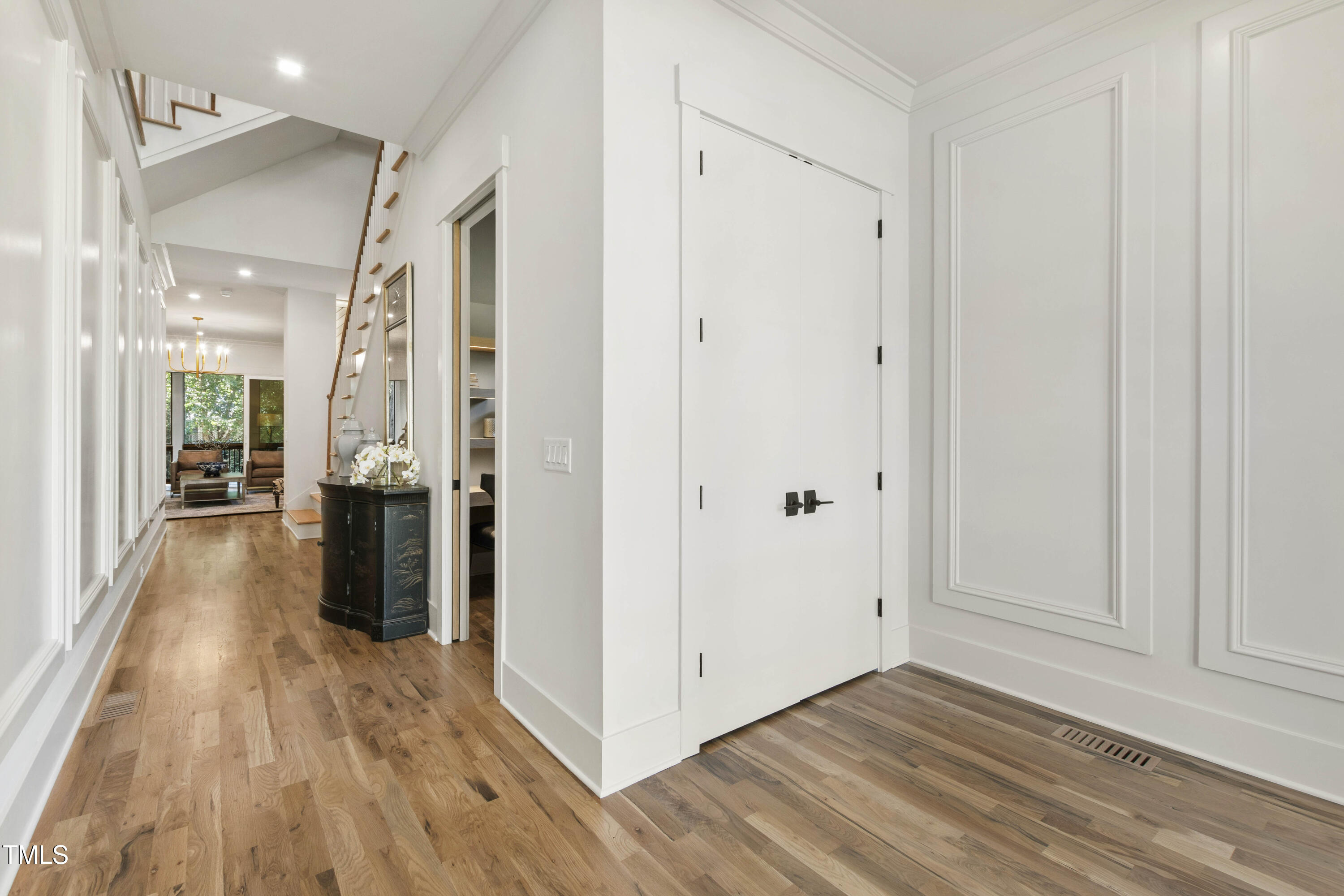 202 Georgetown Road Raleigh, NC 27608 - Photo 5 of 64 a view of a hallway with wooden floor