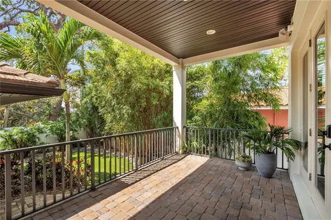 a view of a balcony with furniture