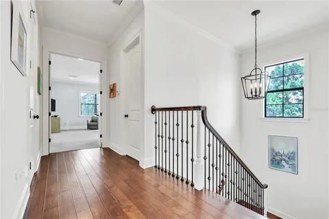 a view of an entryway with wooden floor