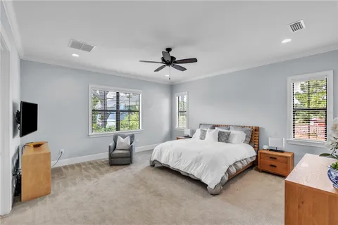 a bedroom with a bed and a couch