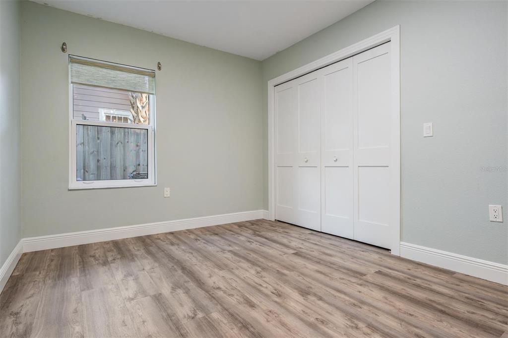 3216 West Fielder Street Tampa, FL 33611 - Photo 22 of 34 a view of empty room with wooden floor and fan