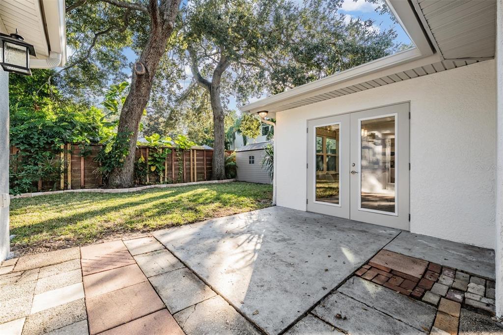 3216 West Fielder Street Tampa, FL 33611 - Photo 24 of 34 a view of a house with backyard and trees