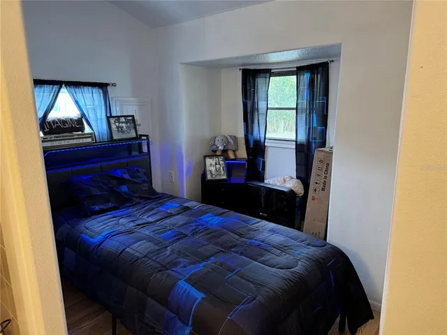 a bedroom with a bed and a dresser