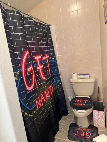 a bathroom with a toilet and a sink