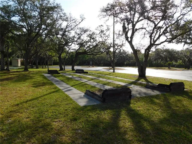 a view of a swimming pool with an outdoor space and seating area