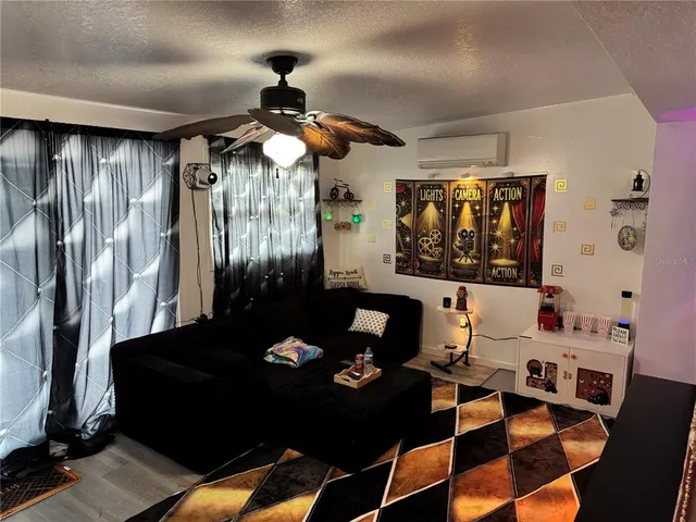 a living room with furniture and a window