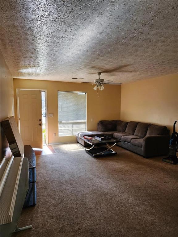 606 Pine Tree Trail, Unit 7C Atlanta, GA 30349 - Photo 6 of 8 a view of a room with gym equipment