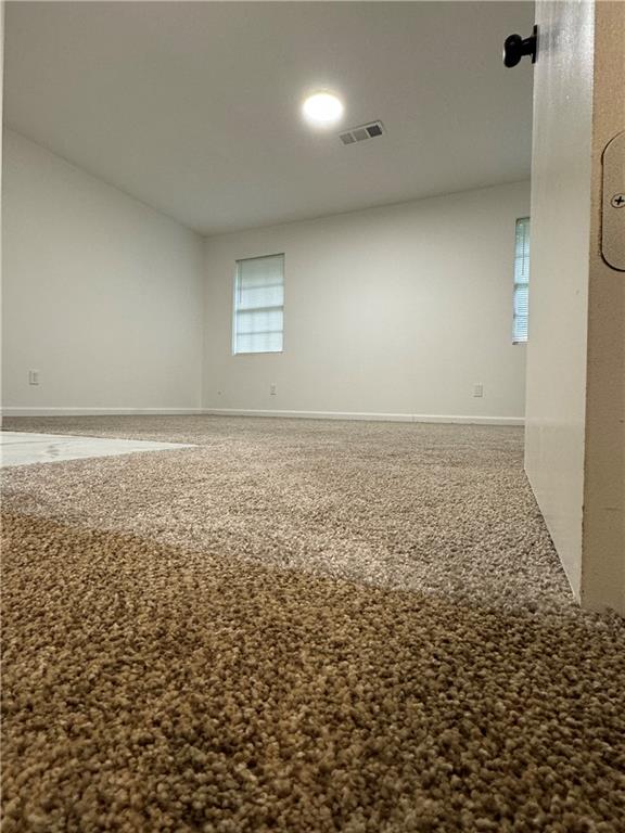 606 Pine Tree Trail, Unit 7C Atlanta, GA 30349 - Photo 8 of 8 an empty room with a natural light