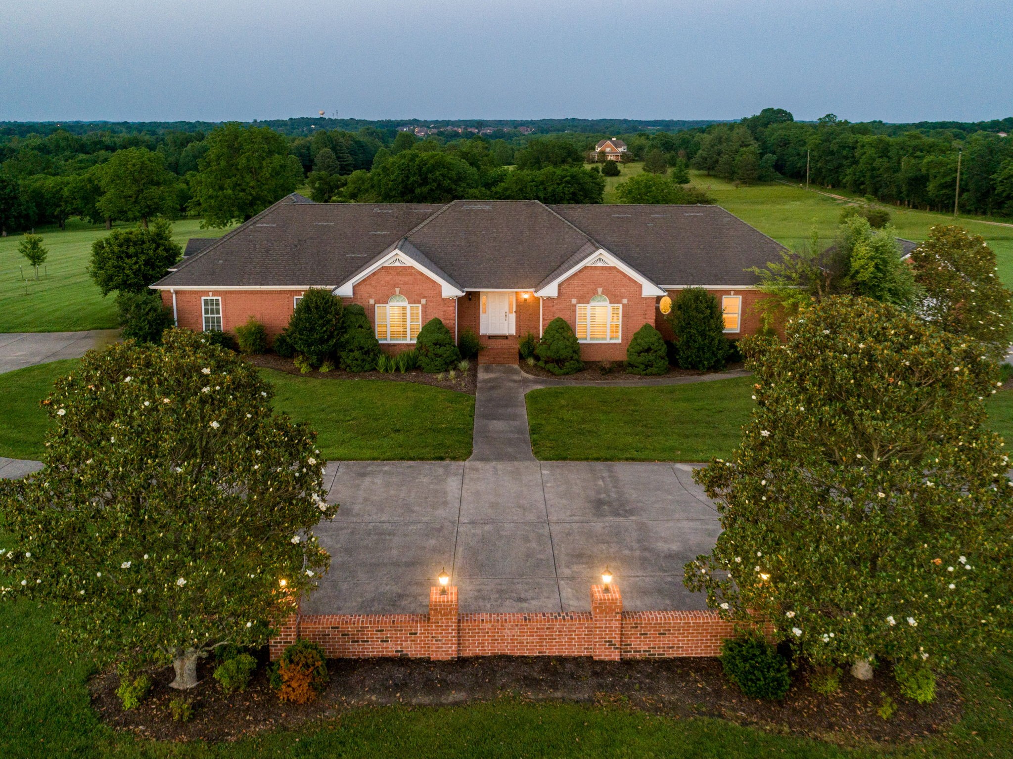 an aerial view of a house with yard swimming pool and outdoor seating