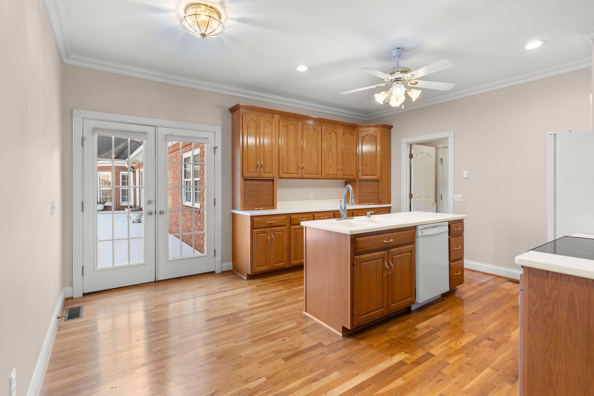 1729 Hudson Road Madison, TN 37115 - Photo 57 of 69 a kitchen with stainless steel appliances granite countertop a stove a sink dishwasher and a refrigerator with wooden floor