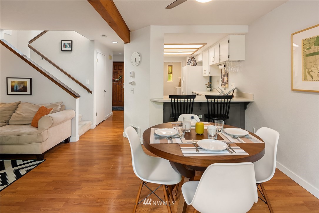 7512 218th Street Southwest, Unit 5 Edmonds, WA 98026 - Photo 12 of 25 a dining room with furniture and wooden floor
