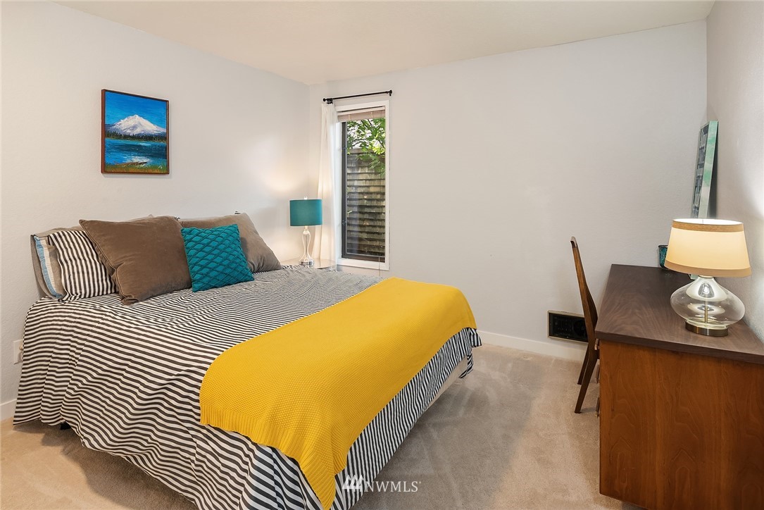 7512 218th Street Southwest, Unit 5 Edmonds, WA 98026 - Photo 14 of 25 a bedroom with a bed and dresser