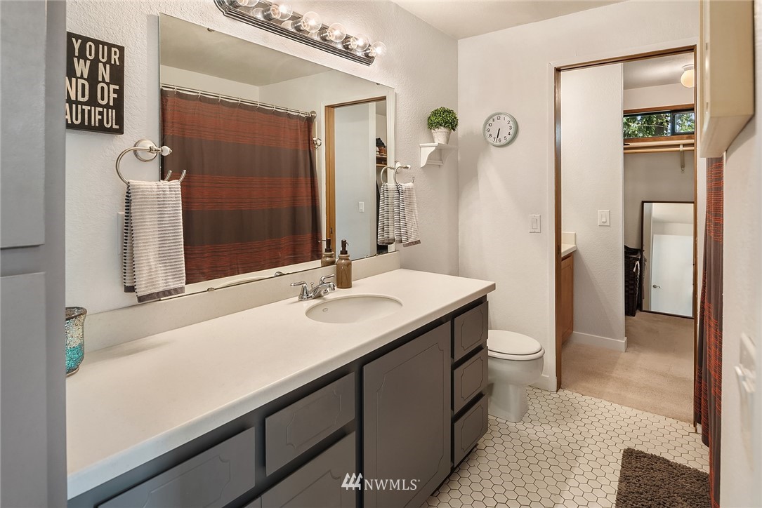 7512 218th Street Southwest, Unit 5 Edmonds, WA 98026 - Photo 16 of 25 a bathroom with a sink a toilet and shower