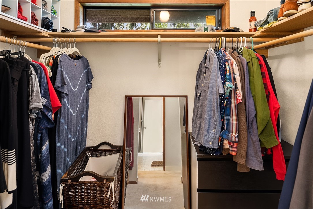 7512 218th Street Southwest, Unit 5 Edmonds, WA 98026 - Photo 17 of 25 a view of walk in closet with clothes and shoes