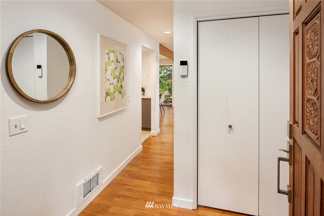 7512 218th Street Southwest, Unit 5 Edmonds, WA 98026 - Photo 3 of 25 a view of a hallway with wooden floor and entryway