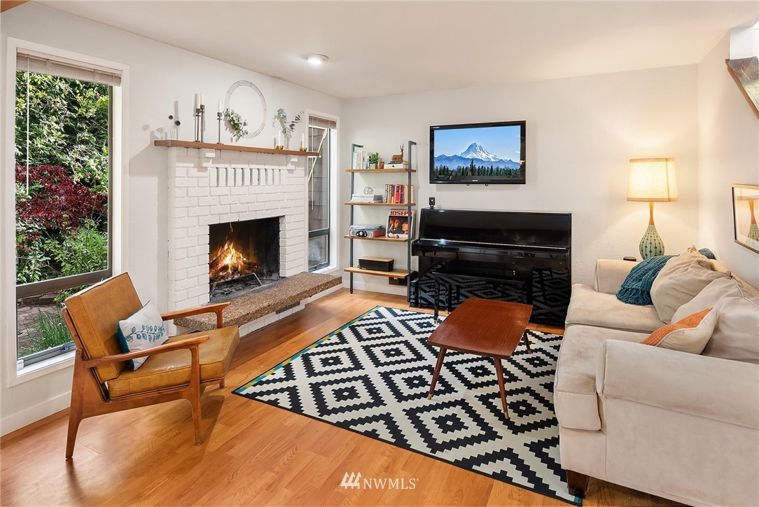 7512 218th Street Southwest, Unit 5 Edmonds, WA 98026 - Photo 10 of 25 a living room with furniture and a fireplace