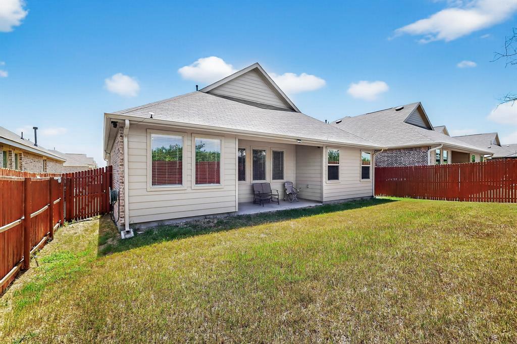 444 Ranchito Pass Fort Worth, TX 76052 - Photo 17 of 24 a front view of a house with garden