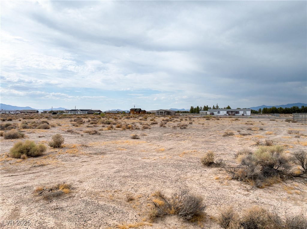2181 Bennet Street Pahrump, NV 89048 - Photo 13 of 15 View of undeveloped land with a mountain backdrop
