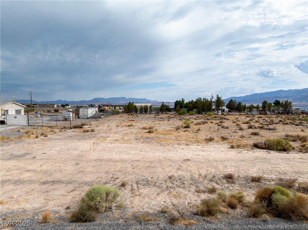 2181 Bennet Street Pahrump, NV 89048 - Photo 6 of 15 View of yard with a mountain view and a view of co