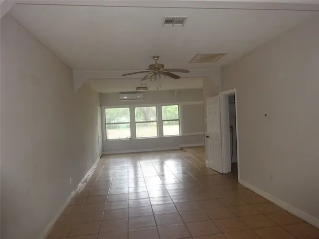 a view of an empty room and window