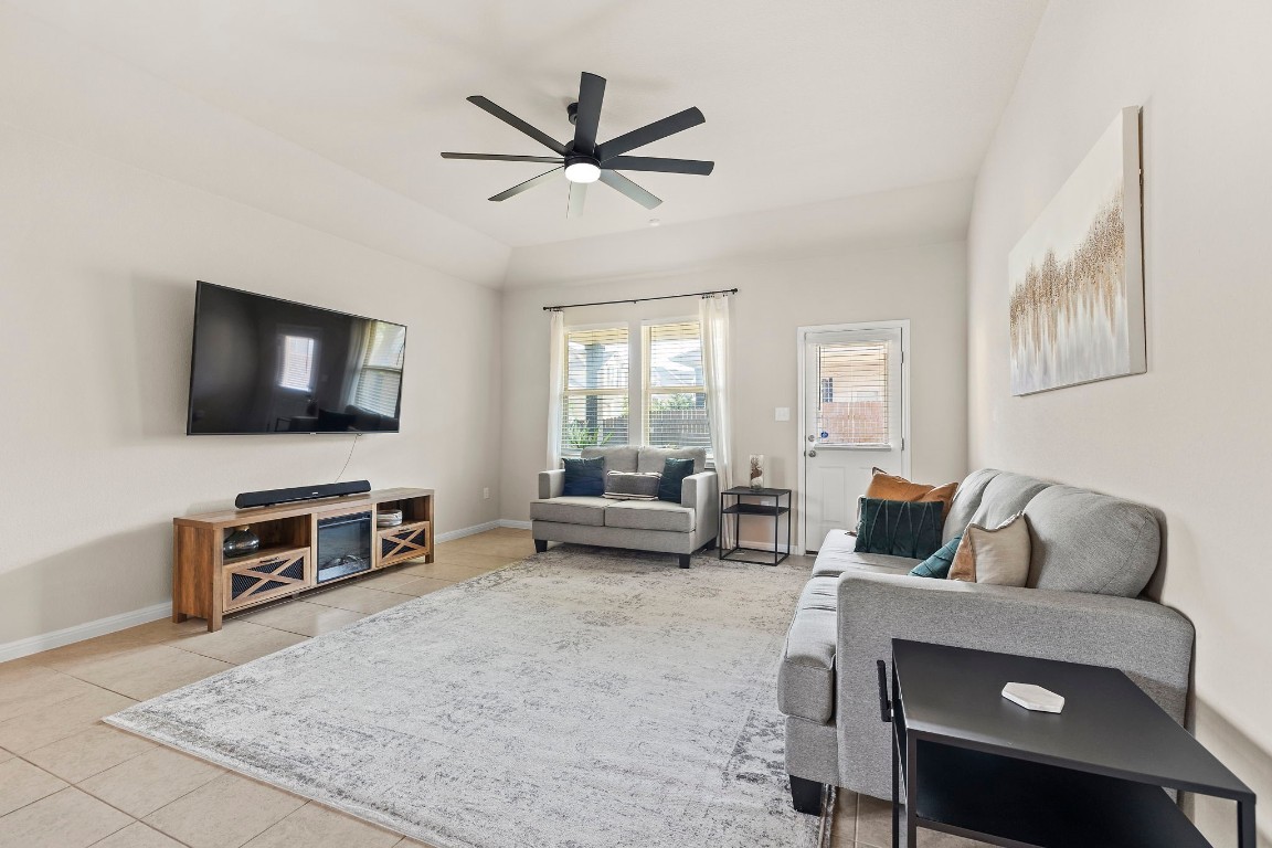 11901 Dispatch Way Austin, TX 78748 - Photo 6 of 18 a living room with furniture and a flat screen tv