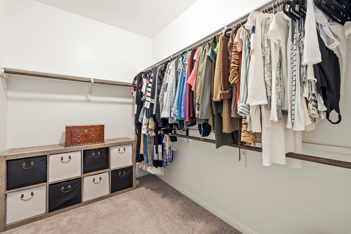 11901 Dispatch Way Austin, TX 78748 - Photo 10 of 18 a view of walk in closet with clothes and shoes