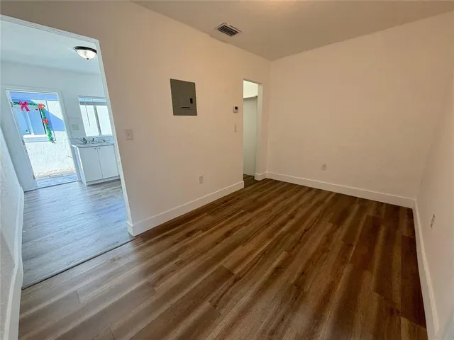 a view of wooden floor in an empty room