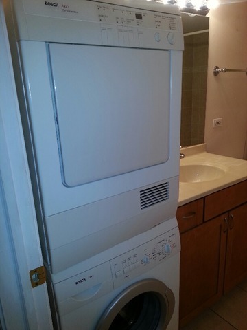 1000 South Lorraine Road, Unit 410 Wheaton, IL 60189 - Photo 12 of 12 a utility room with dryer and washer
