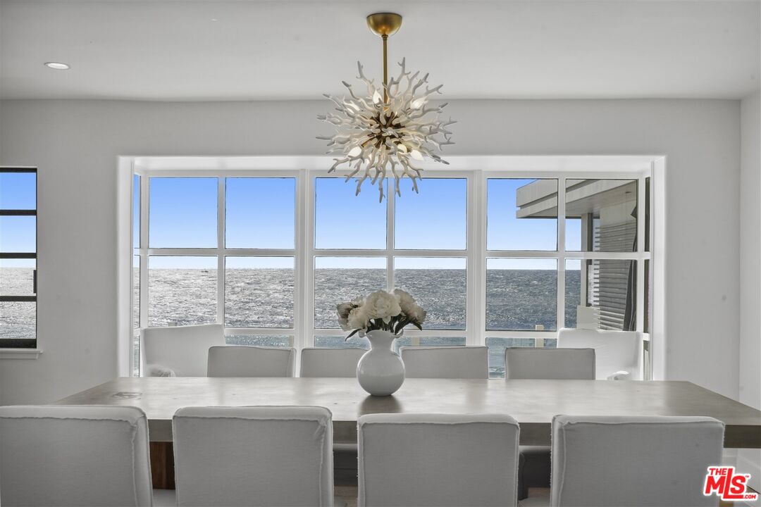 31500 Victoria Point Road Malibu, CA 90265 - Photo 1 of 53 a view of a room with a large window and chandelier