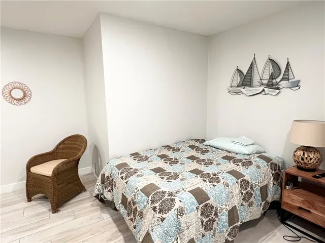 a bedroom with a bed and a chair