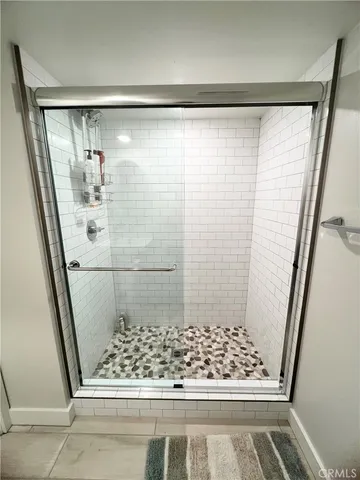 a bathroom with a shower and toilet